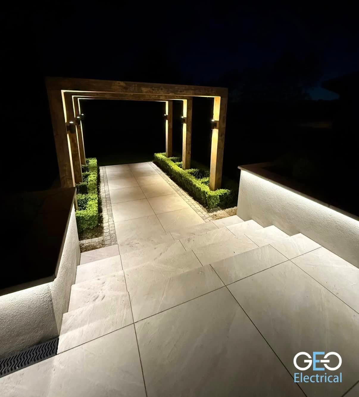 Outdoor architectural and garden lighting at a private home at night