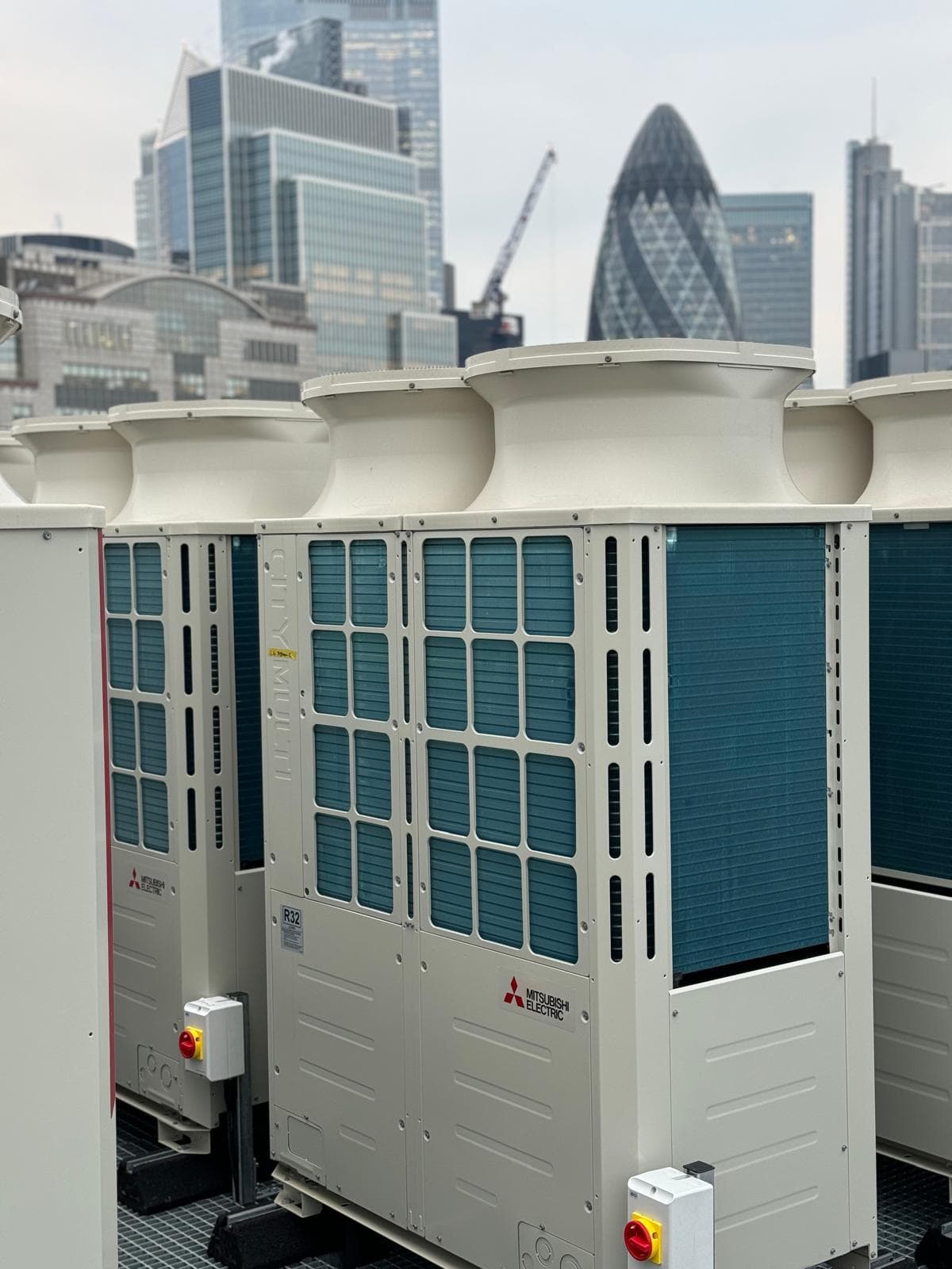 Rooftop air-conditioning and HVAC installation by GEO Electrical, with the City of London skyline behind